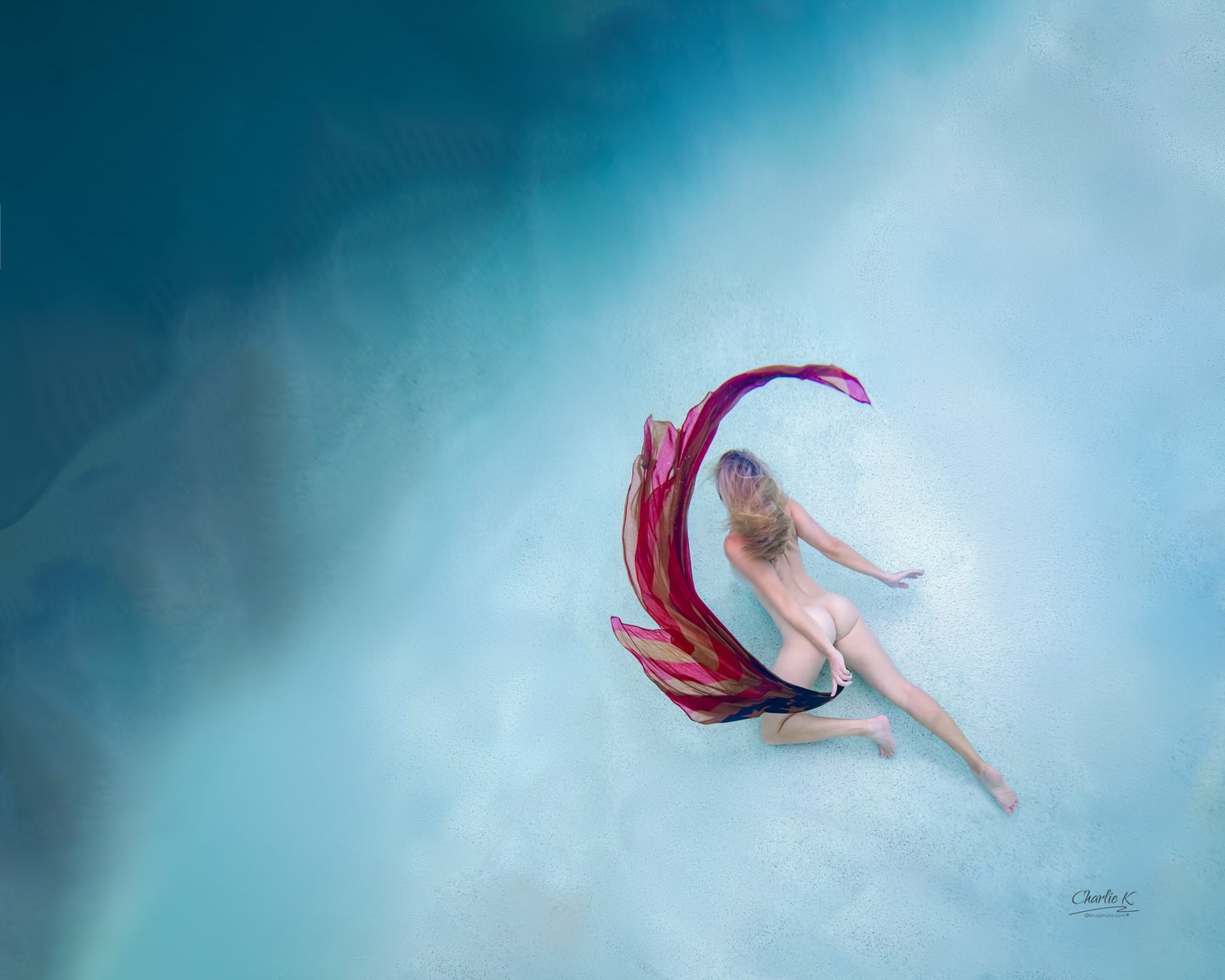 Underwater figure with crimson silk